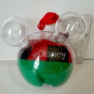 NWT Disney-themed socks packaged inside a clear, Mickey Mouse-shaped ornament